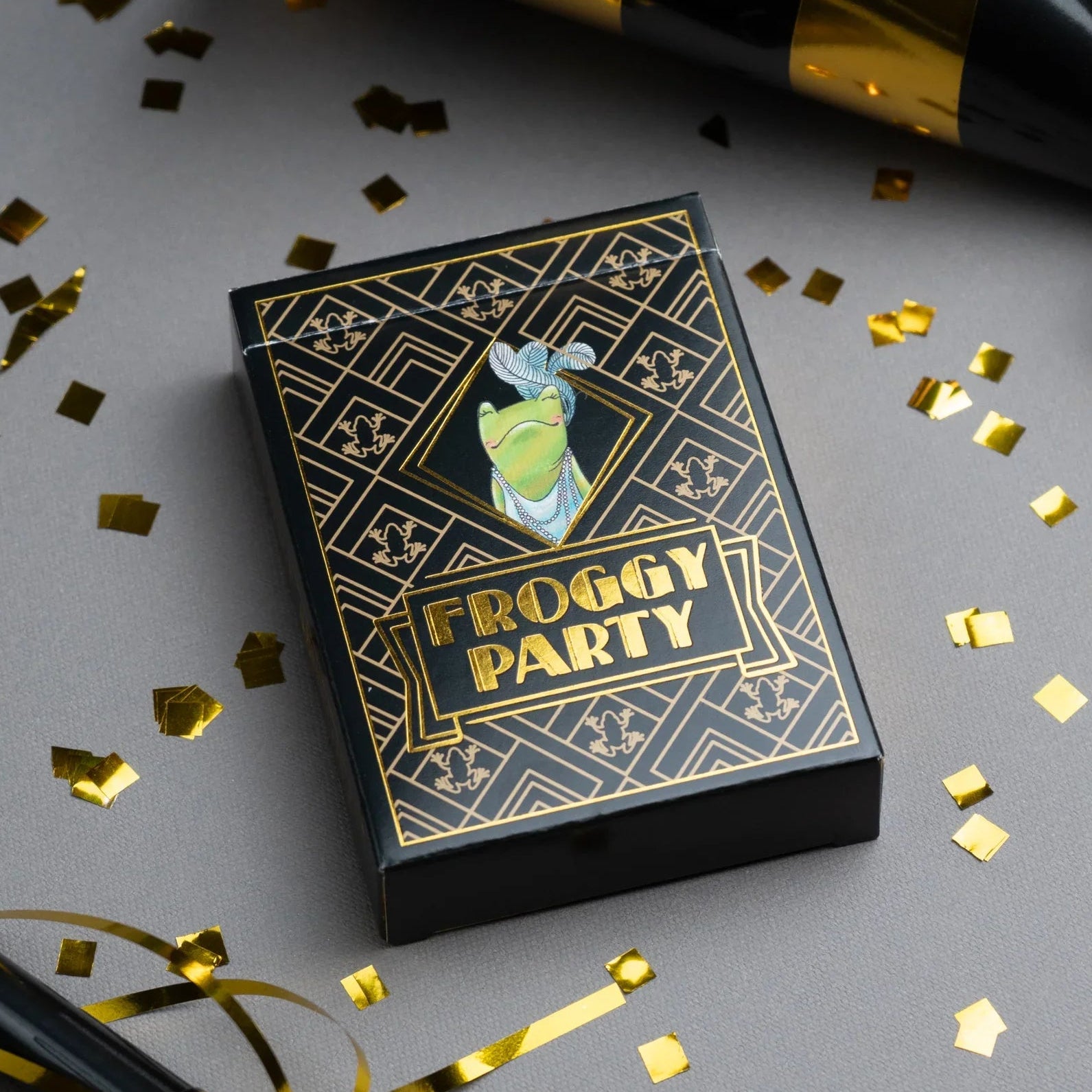 Froggy Party card game box with gold confetti and party hats on a gray background