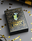 Froggy Party card game box with gold confetti and party hats on a gray background