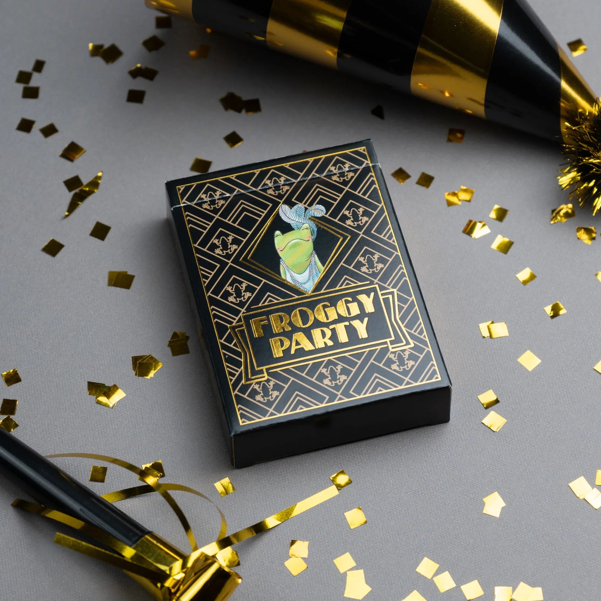 Froggy Party card game box with gold confetti and party hats on a gray background